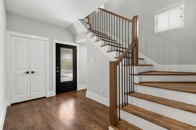 a view of wooden staircase and stairs