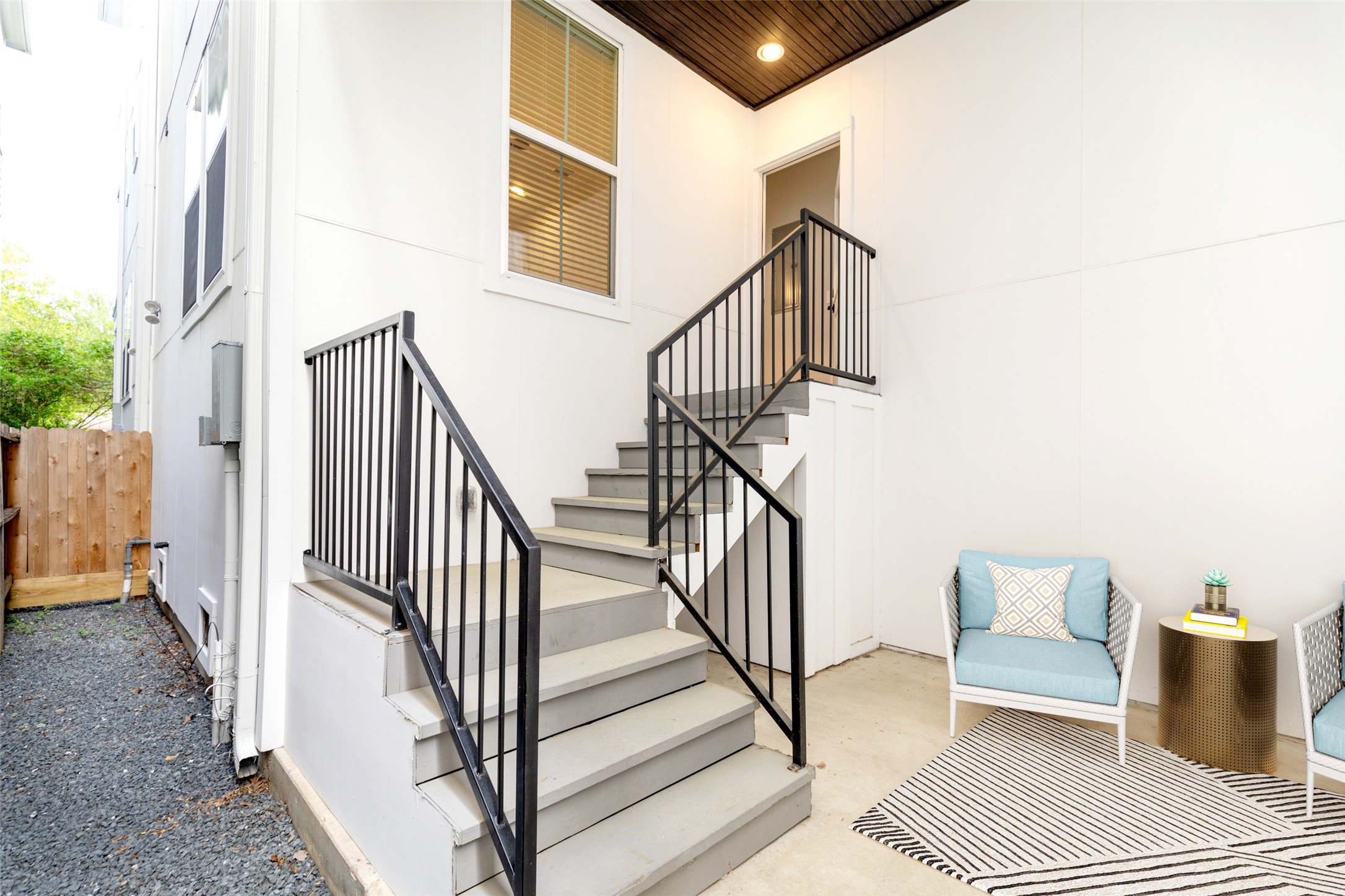 1421 West 23rd Street, Unit C Houston, TX 77008 - Photo 33 of 40 a view of staircase with lots of frames and a rug