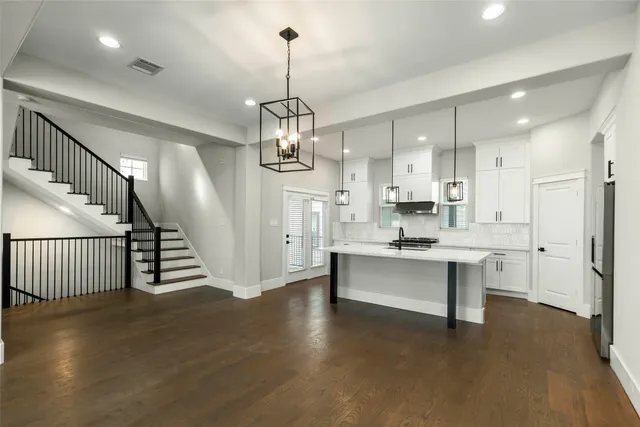 a view of a kitchen and sink stainless steel appliances