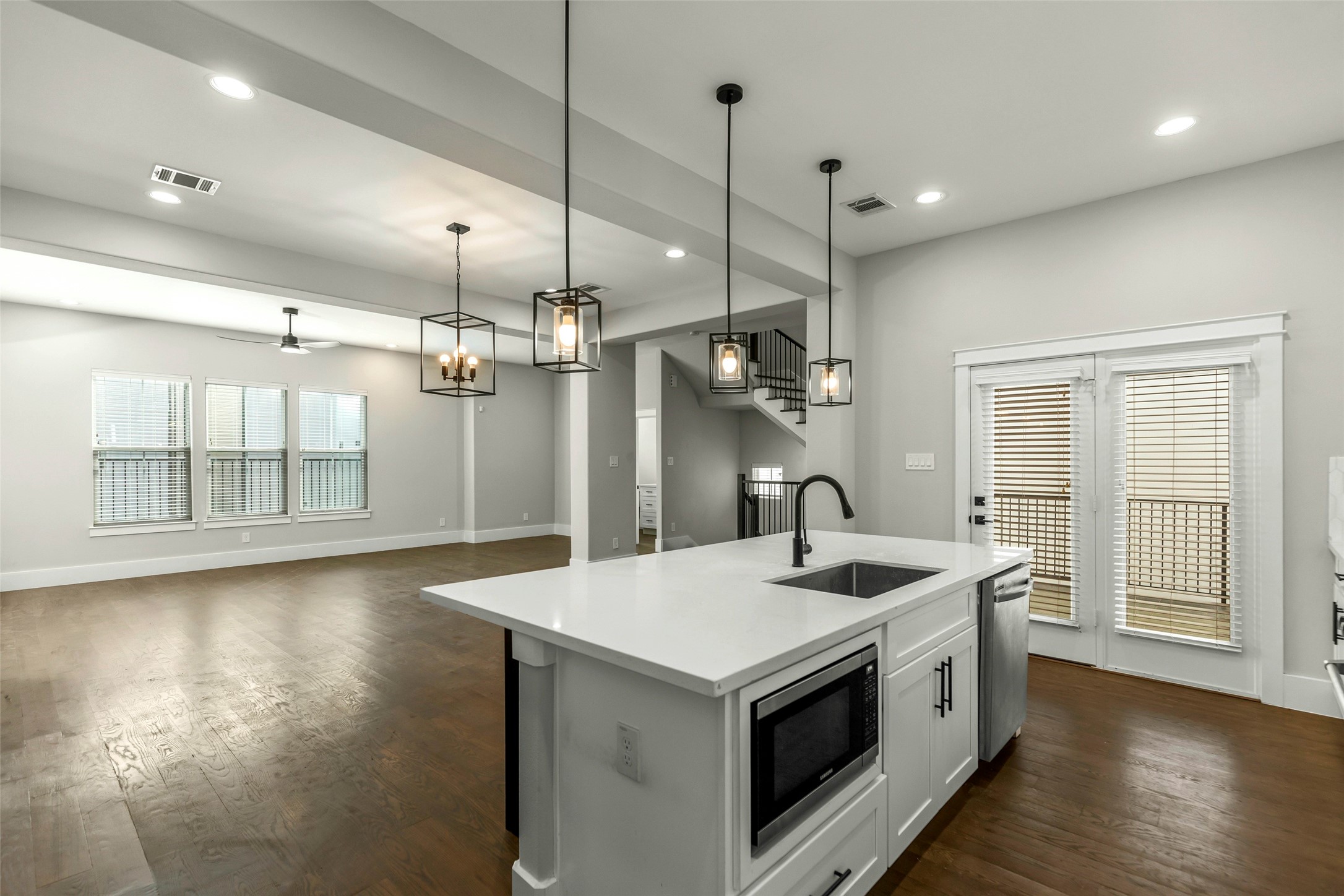 1421 West 23rd Street, Unit C Houston, TX 77008 - Photo 9 of 40 a kitchen with stainless steel appliances granite countertop a sink and a refrigerator