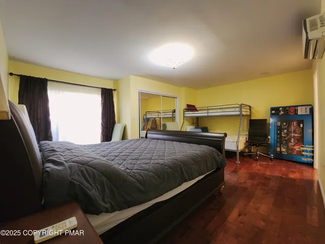 a view of a livingroom with furniture and a flat screen tv