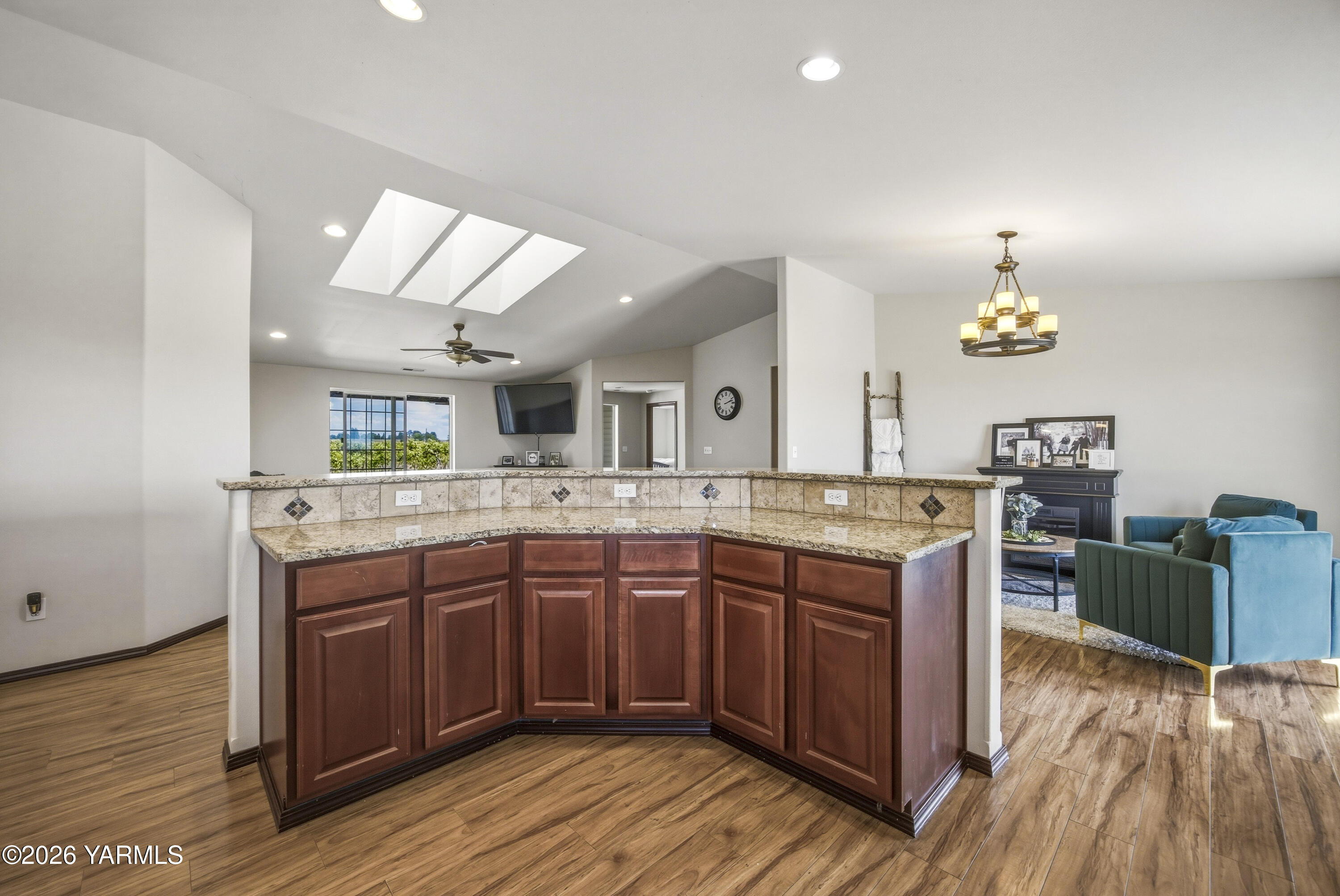 2050 Olmstead Road Grandview, WA 98930 - Photo 31 of 60 a kitchen with a sink cabinets and wooden floor