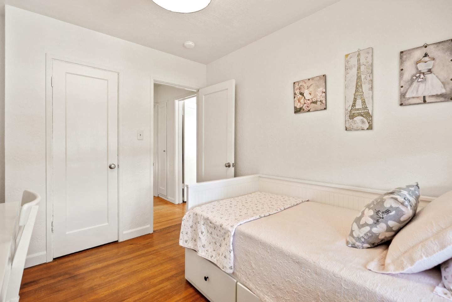 2250 Tulip Road San Jose, CA 95128 - Photo 18 of 39 a bedroom with a bed and a wooden floor
