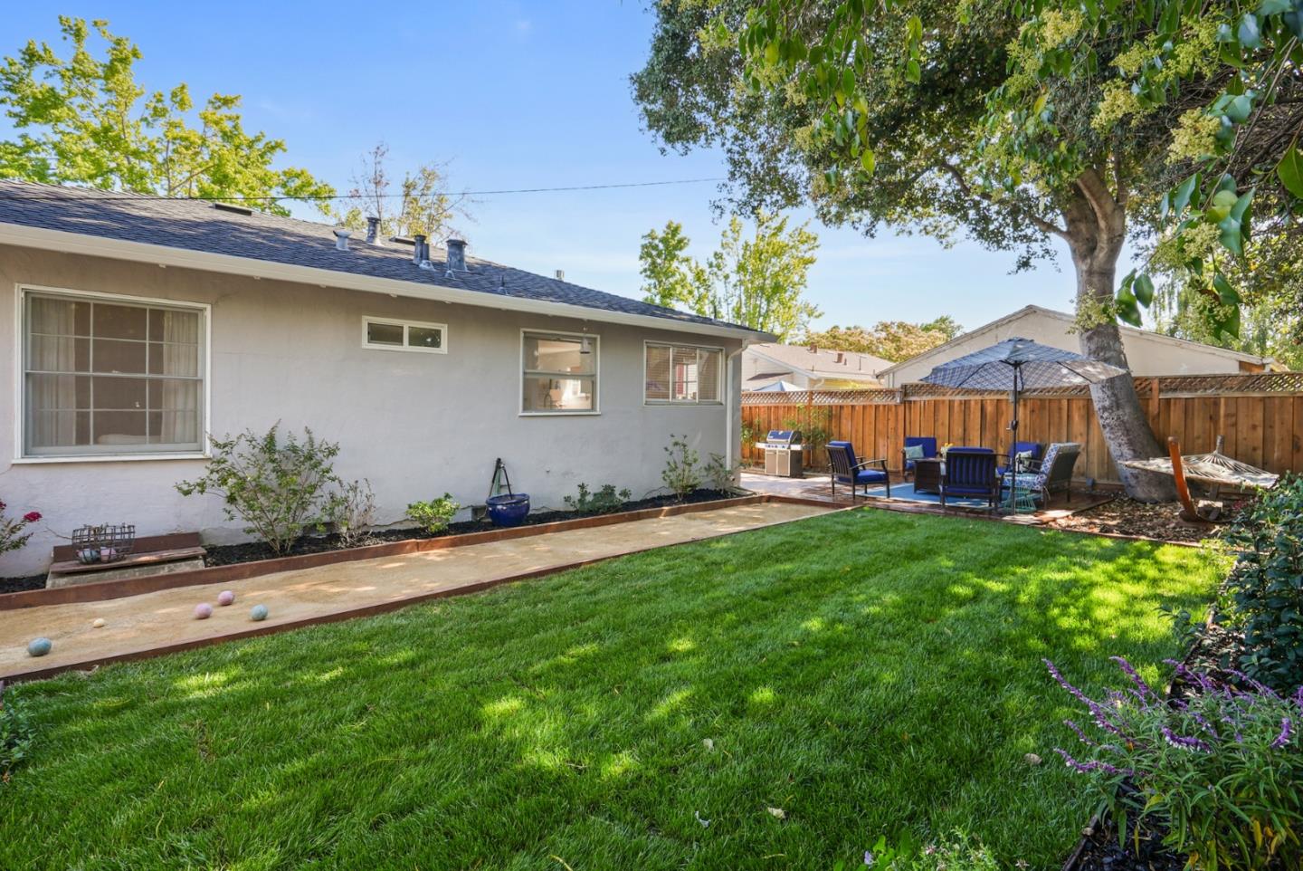 2250 Tulip Road San Jose, CA 95128 - Photo 23 of 39 a backyard of a house with yard table and chairs