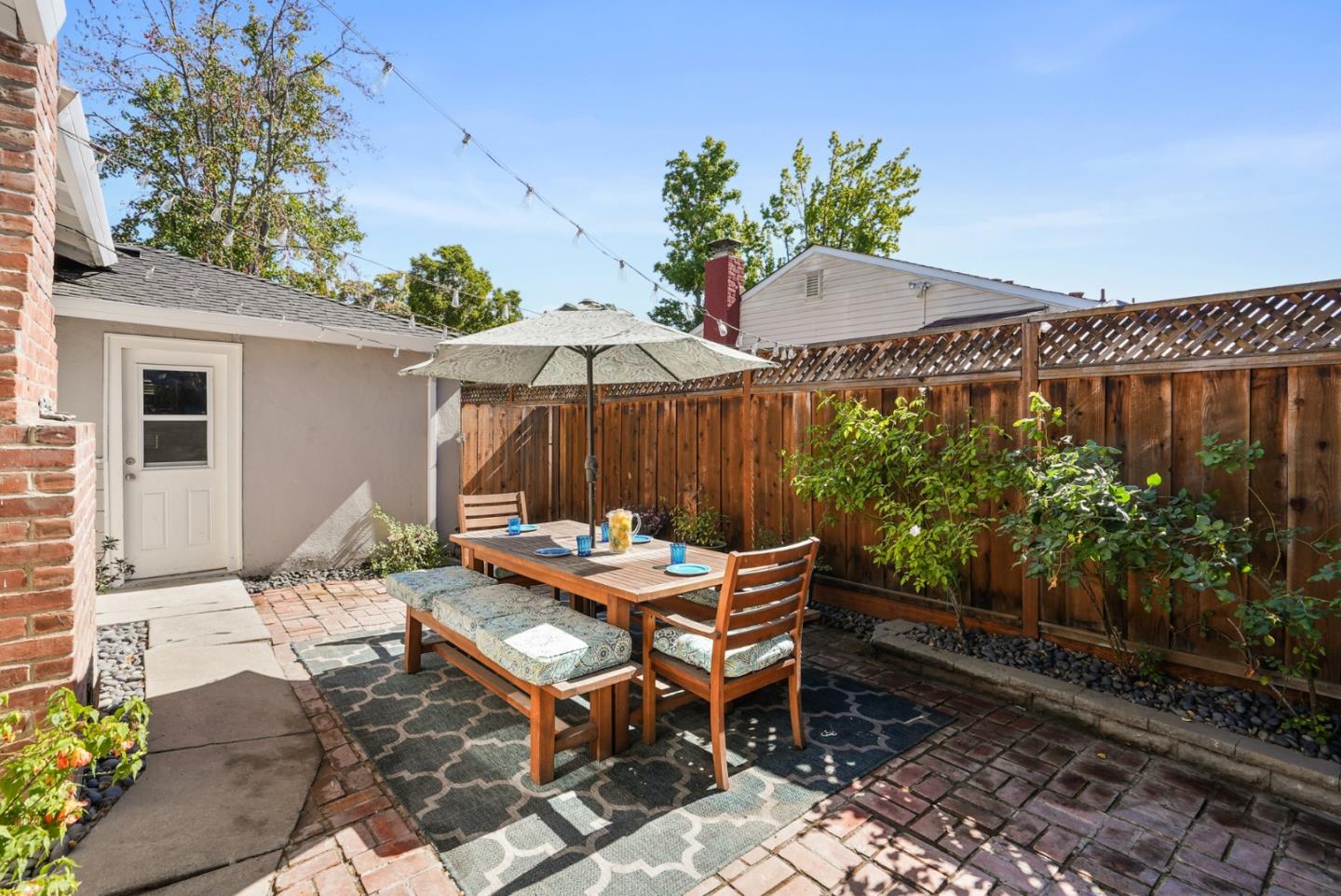 2250 Tulip Road San Jose, CA 95128 - Photo 27 of 39 a backyard of a house with table and chairs