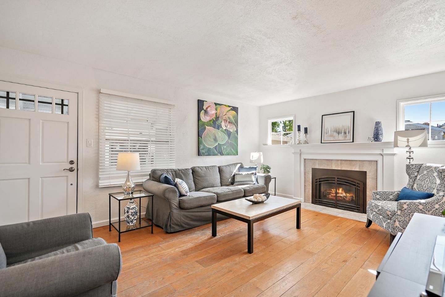 2250 Tulip Road San Jose, CA 95128 - Photo 4 of 39 a living room with furniture and a fireplace