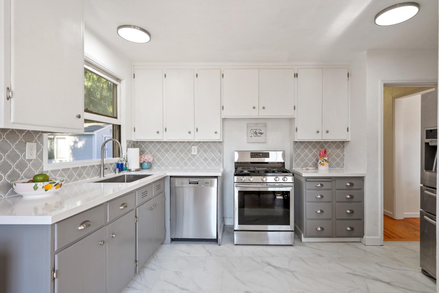 2250 Tulip Road San Jose, CA 95128 - Photo 10 of 39 a kitchen with stainless steel appliances granite countertop a stove a sink and a refrigerator