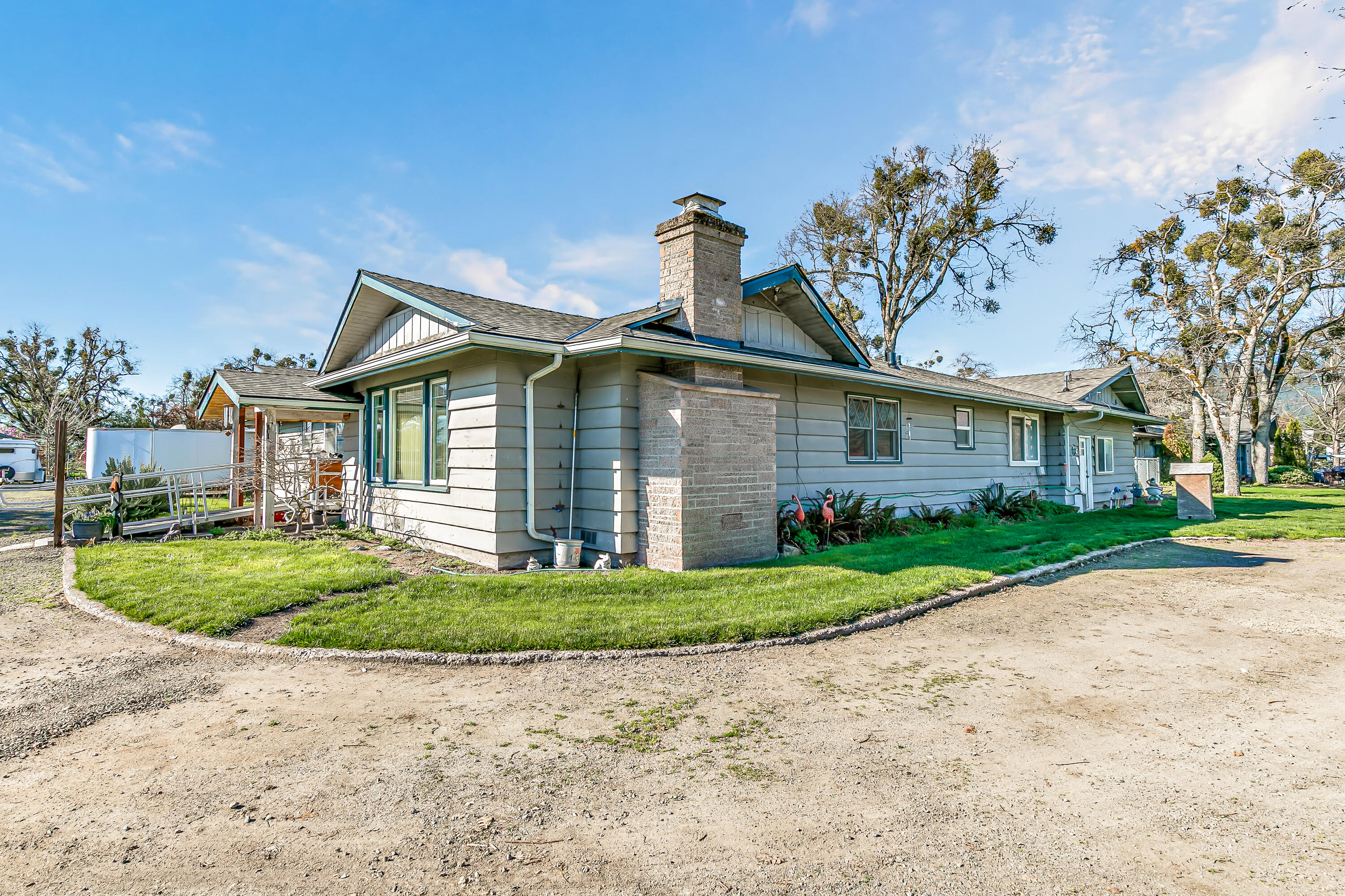 3200 Hanley Road Central Point, OR 97502 - Photo 2 of 25 a front view of a house with a yard and garage