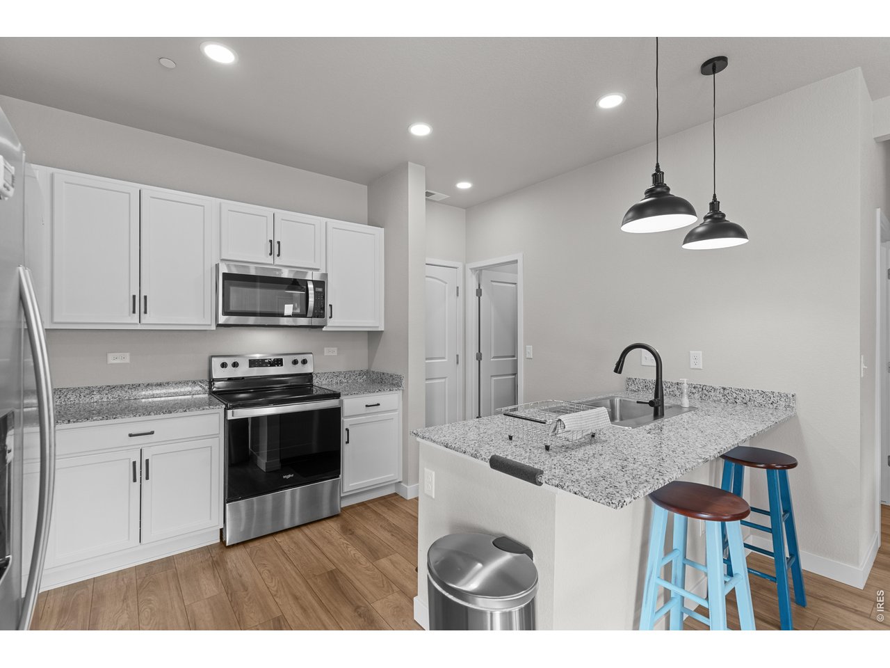6611 4th Street, Unit 1 Greeley, CO 80634 - Photo 13 of 48 Granite countertops and stainless steel appliances. Walk-in pantry for additional utility!