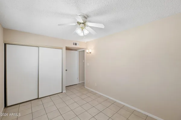 a bathroom with a sink toilet a mirror and shower