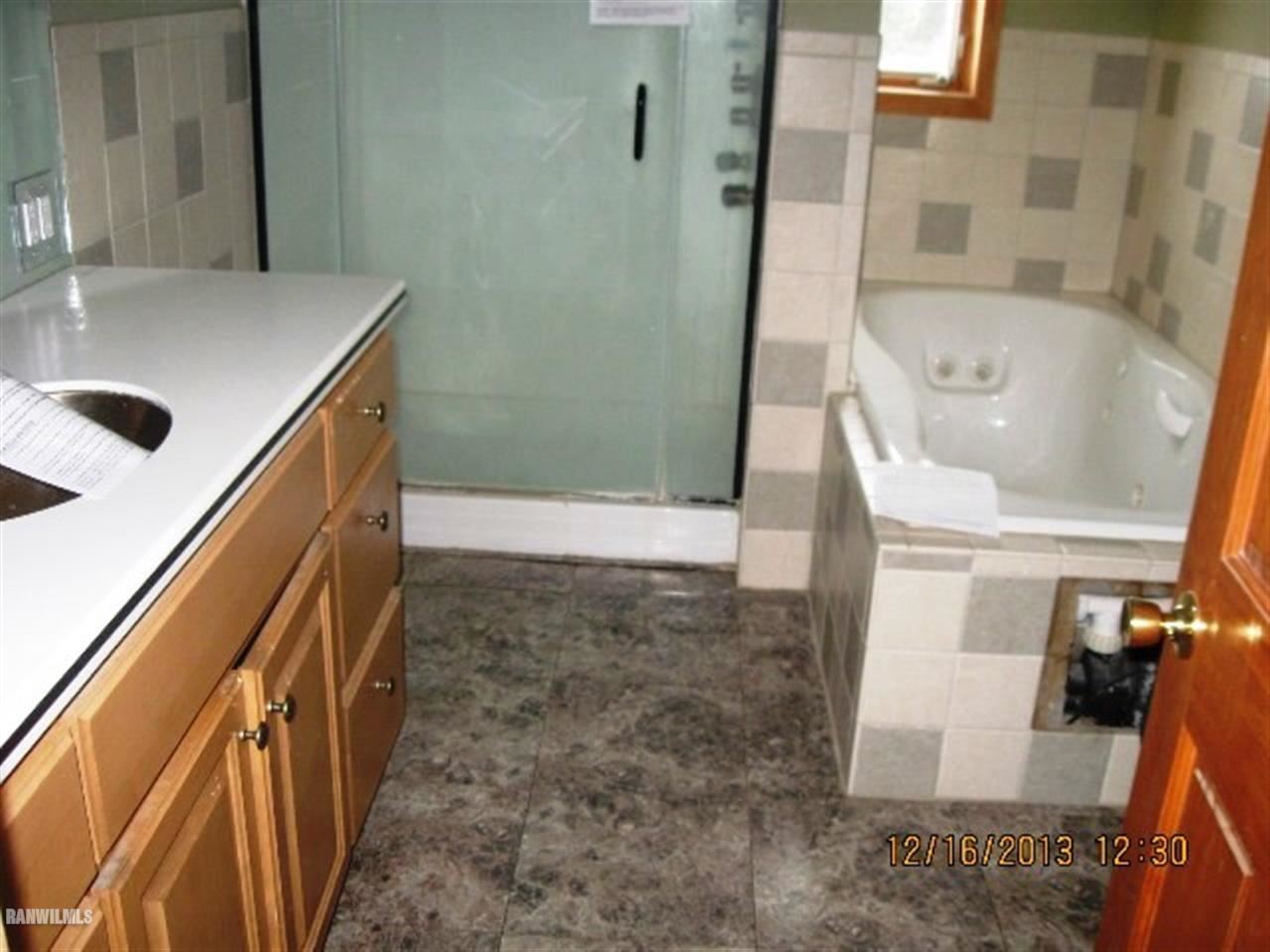 1471 West Becker School Road Freeport, IL 61032 - Photo 15 of 21 a bathroom with a tub sink and mirror