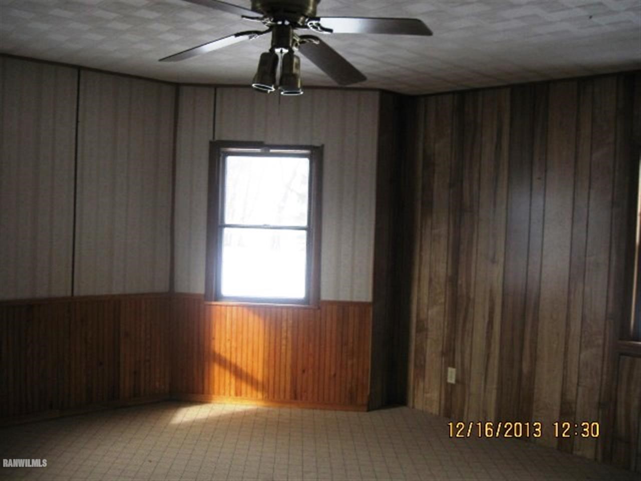 1471 West Becker School Road Freeport, IL 61032 - Photo 10 of 21 an empty room with windows and fan