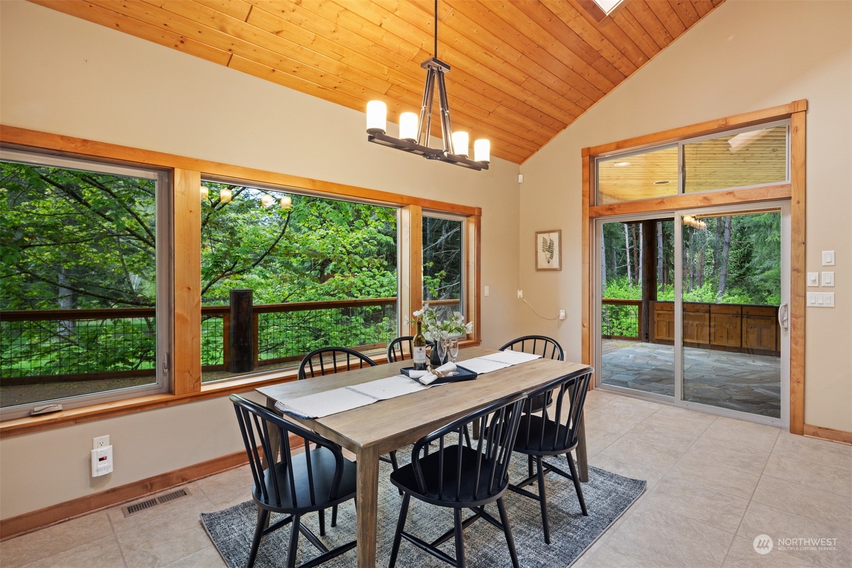 1815 High Noon Road Bellingham, WA 98226 - Photo 17 of 40 a view of a dining room with furniture large windows and wooden floor