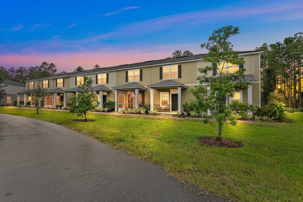 a front view of a house with a yard
