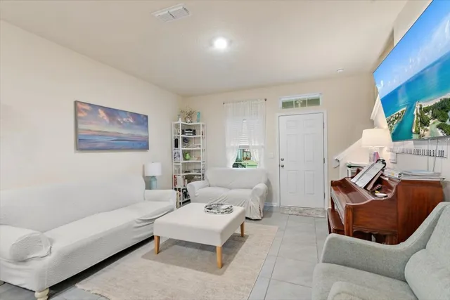 a living room with furniture and a rug