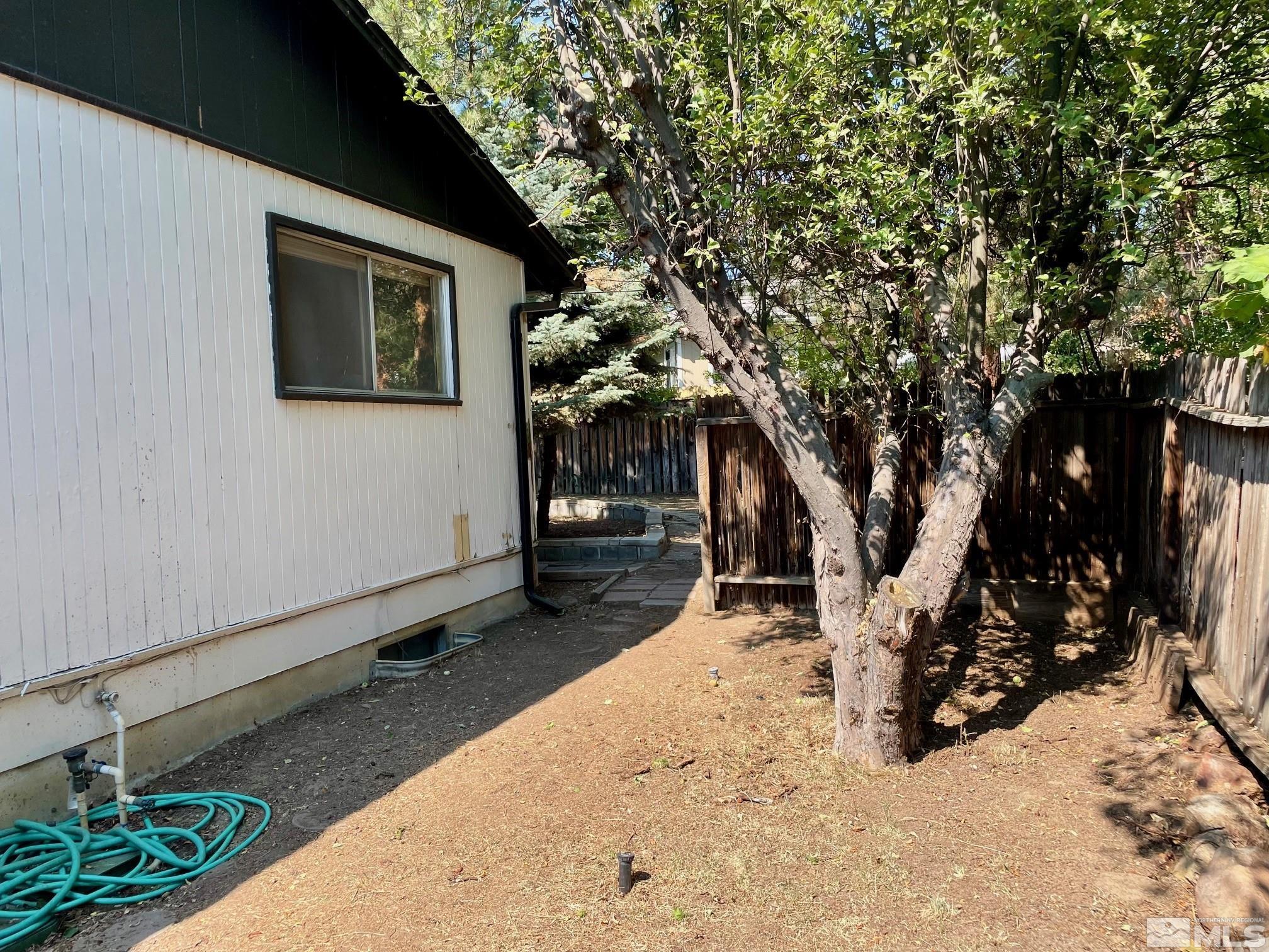1475 Alturas Avenue Reno, NV 89503 - Photo 26 of 28 a view of a house with a yard covered in snow