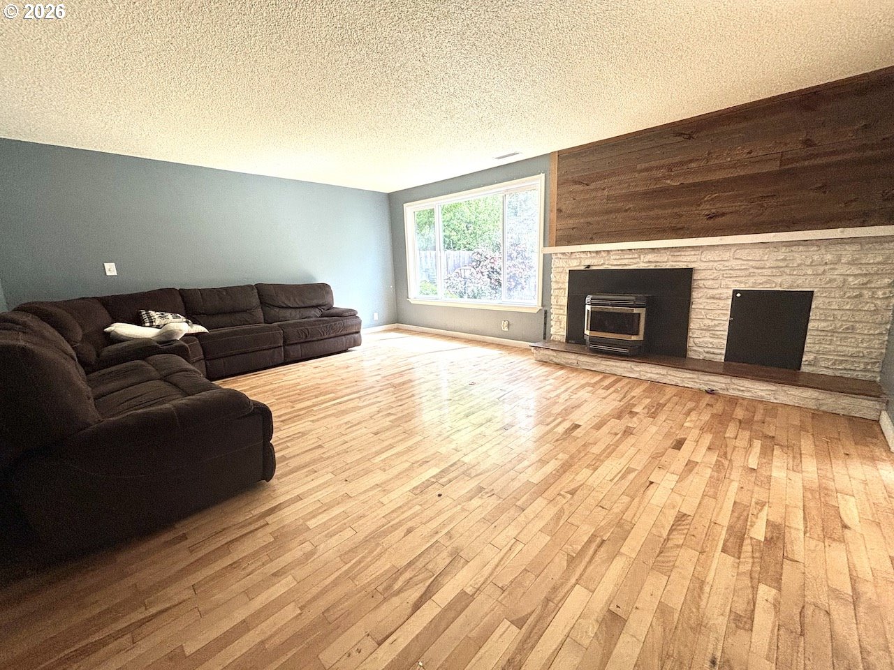 38684 Natures Garden Street Springfield, OR 97478 - Photo 11 of 26 a living room with furniture and a fireplace