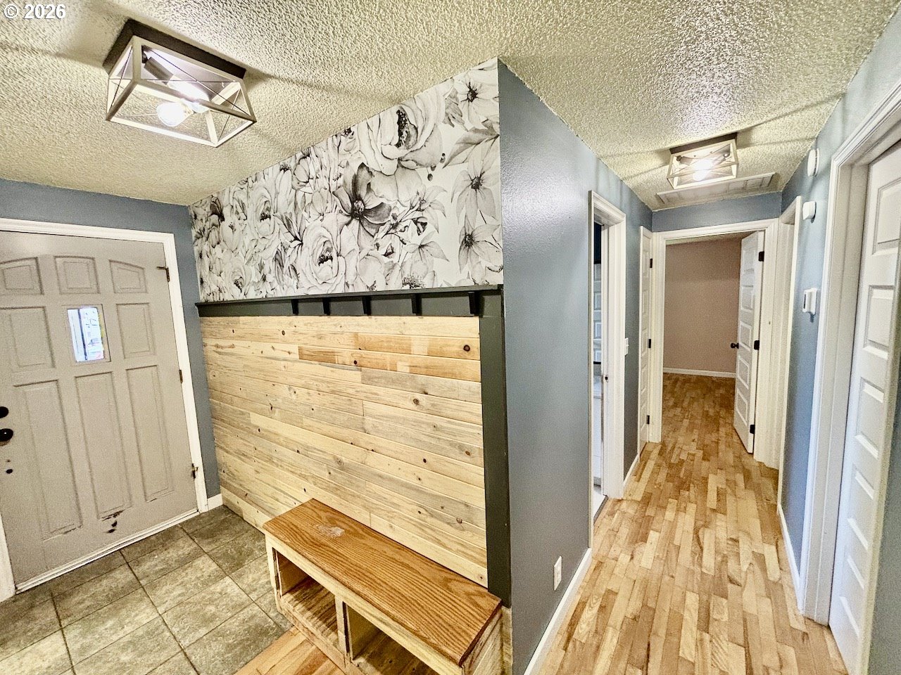 38684 Natures Garden Street Springfield, OR 97478 - Photo 13 of 26 a view of a door with wooden floor