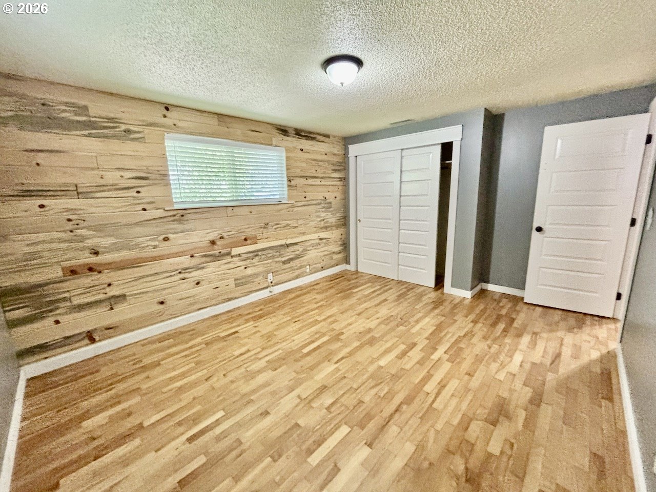 38684 Natures Garden Street Springfield, OR 97478 - Photo 16 of 26 a view of a bedroom with wooden floor and bathroom