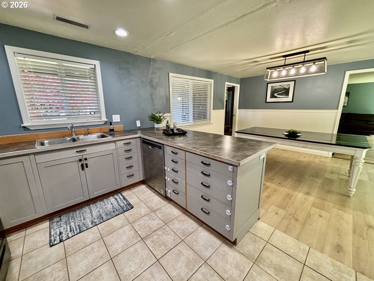 38684 Natures Garden Street Springfield, OR 97478 - Photo 5 of 26 a kitchen with stainless steel appliances granite countertop a sink and a stove