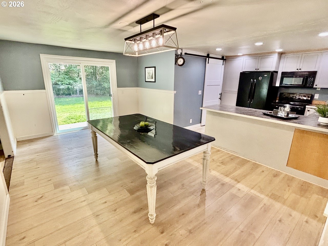 38684 Natures Garden Street Springfield, OR 97478 - Photo 6 of 26 a kitchen with stainless steel appliances kitchen island granite countertop a sink and a stove