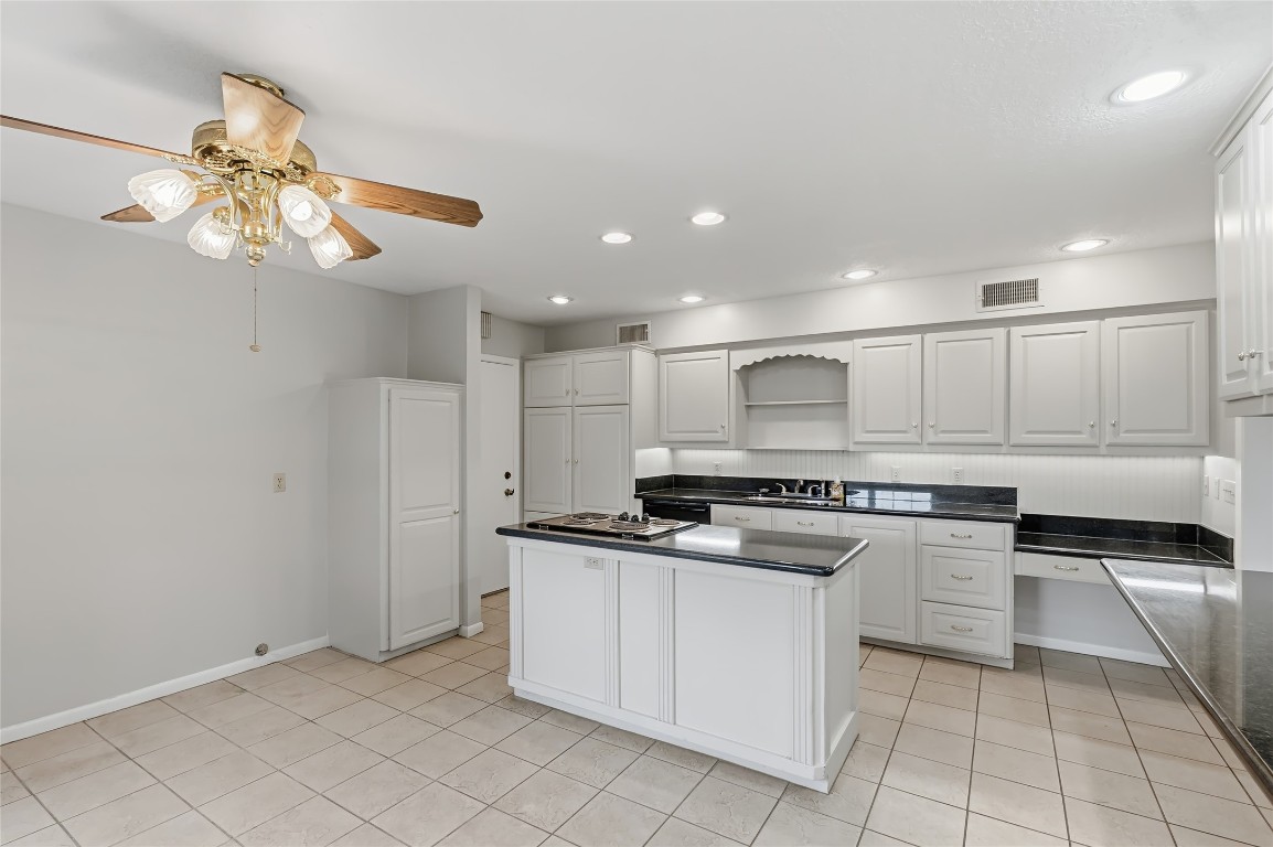 807 Standley Road Madisonville, TX 77864 - Photo 18 of 35 a kitchen with stainless steel appliances granite countertop a stove a sink and a refrigerator