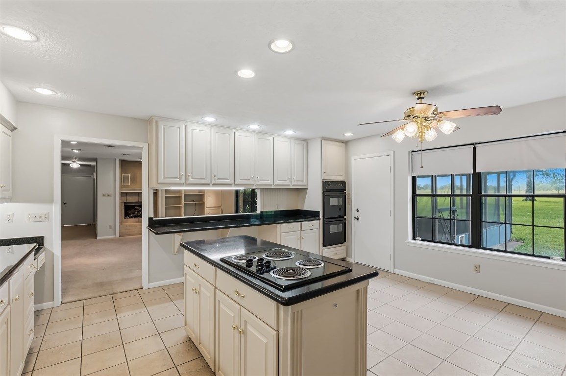 807 Standley Road Madisonville, TX 77864 - Photo 21 of 35 a kitchen with a stove a sink and a refrigerator