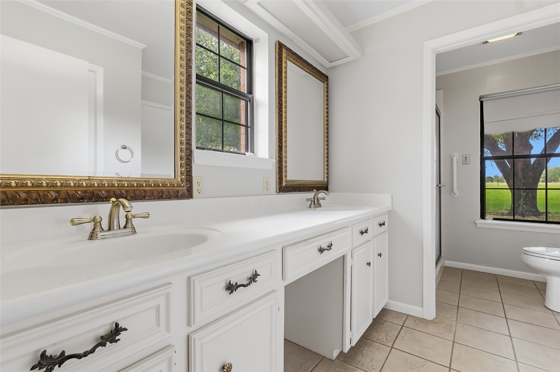 807 Standley Road Madisonville, TX 77864 - Photo 27 of 35 a bathroom with a sink and a toilet