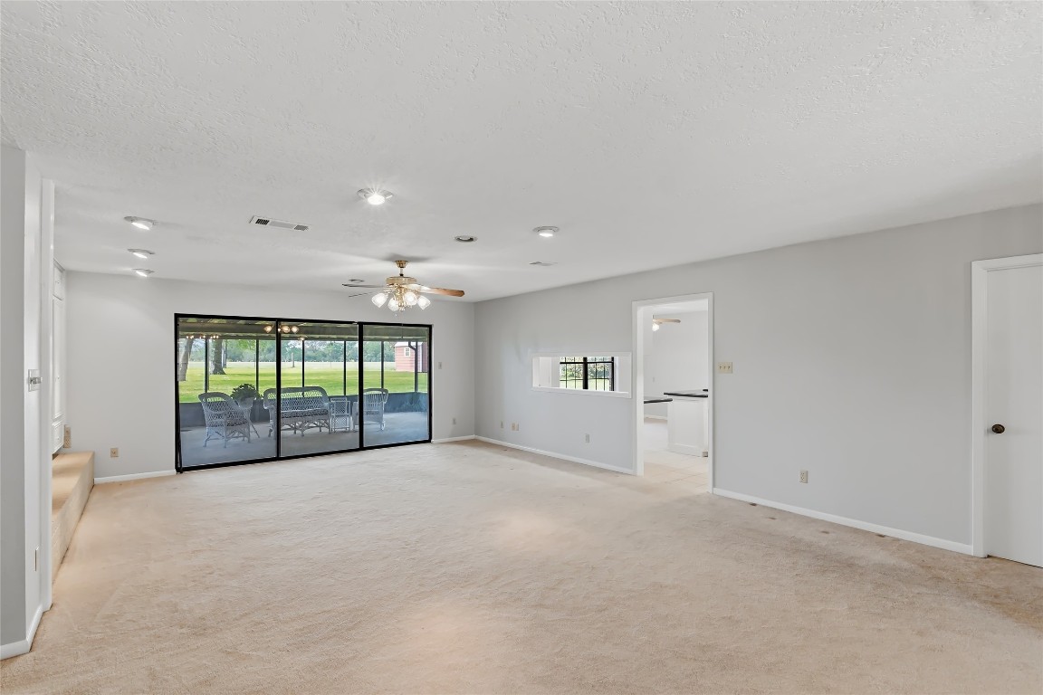807 Standley Road Madisonville, TX 77864 - Photo 8 of 35 a view of an empty room with a sliding door