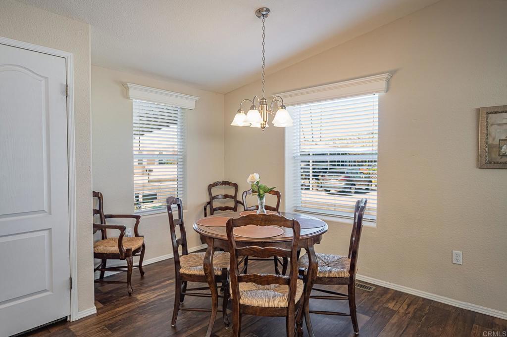 4650 Dulin Road, Unit 40 Fallbrook, CA 92003 - Photo 12 of 52 a view of a dining room with furniture window and wooden floor
