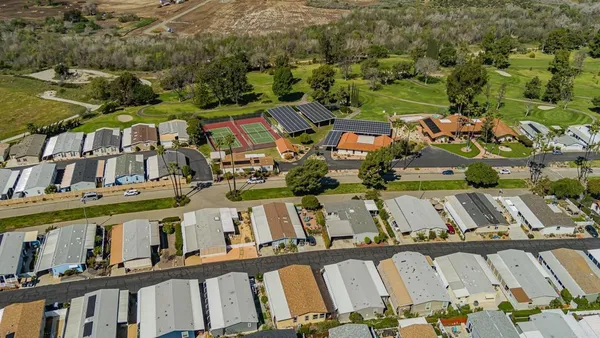 a aerial view of a house with a yard