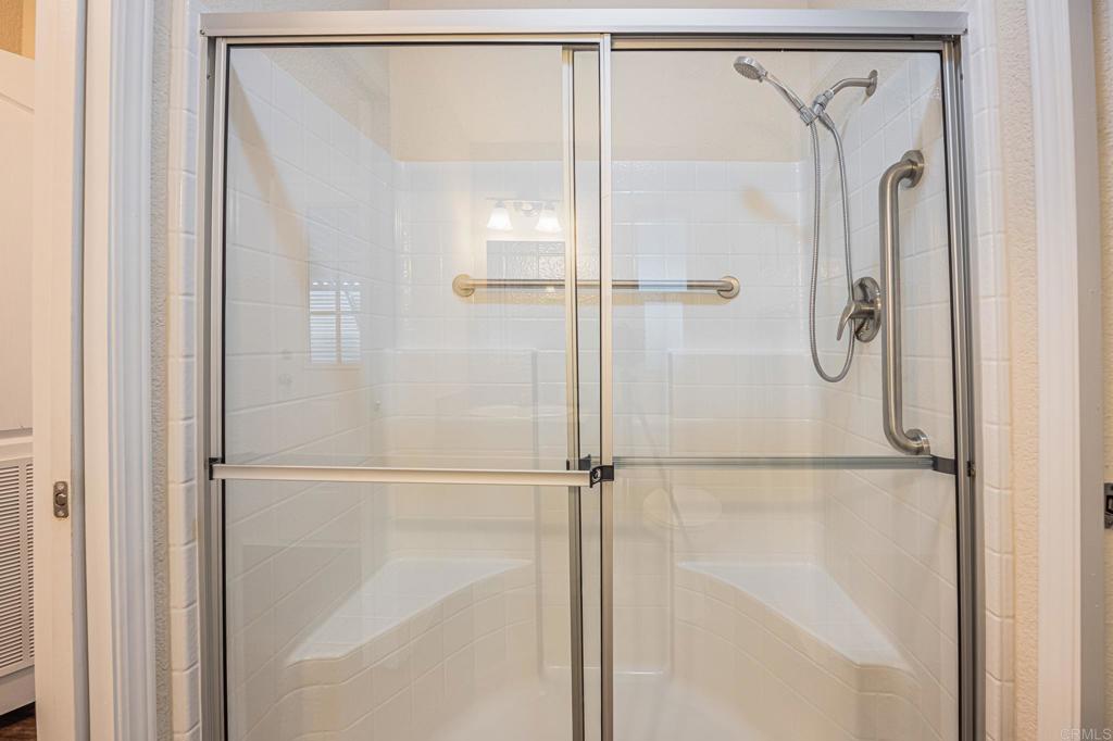4650 Dulin Road, Unit 40 Fallbrook, CA 92003 - Photo 33 of 52 a bathroom with a glass shower door