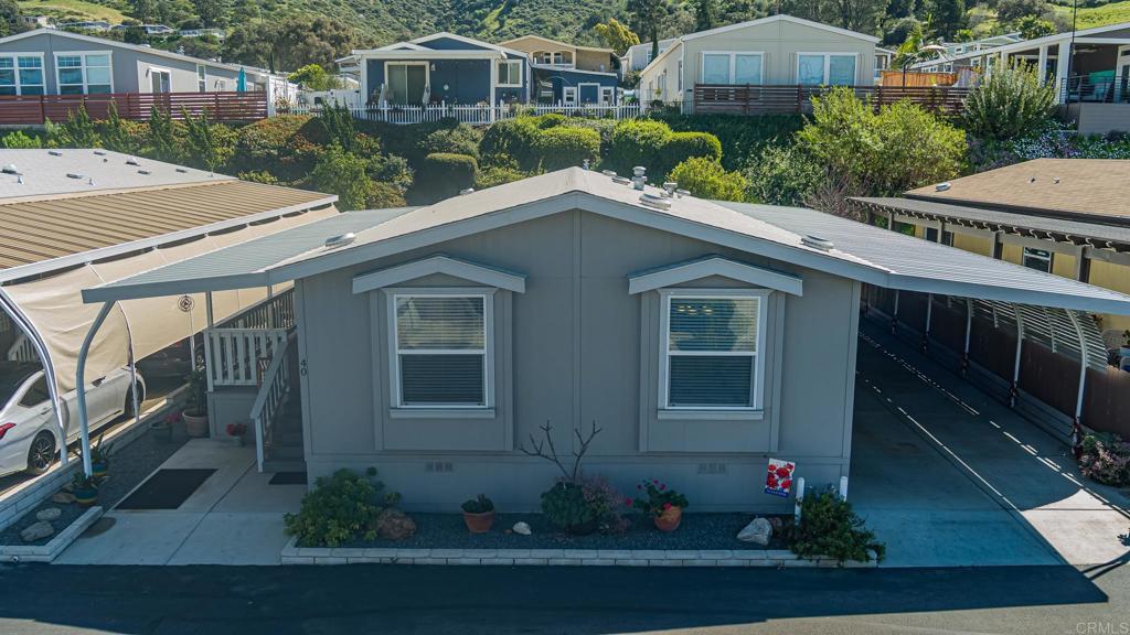4650 Dulin Road, Unit 40 Fallbrook, CA 92003 - Photo 39 of 52 a front view of a house with garden