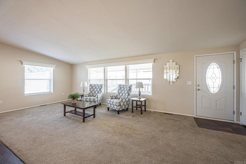 4650 Dulin Road, Unit 40 Fallbrook, CA 92003 - Photo 4 of 52 a living room with furniture and a large window