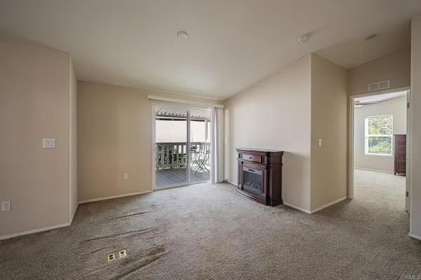 a kitchen that has a lot of cabinets in it and wooden floor