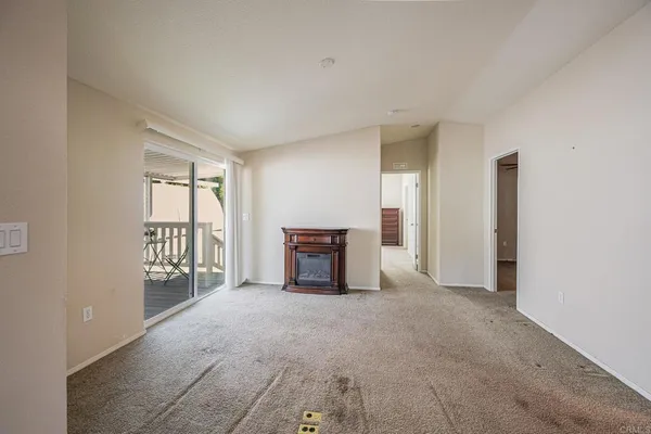 a kitchen with refrigerator cabinets and wooden floor