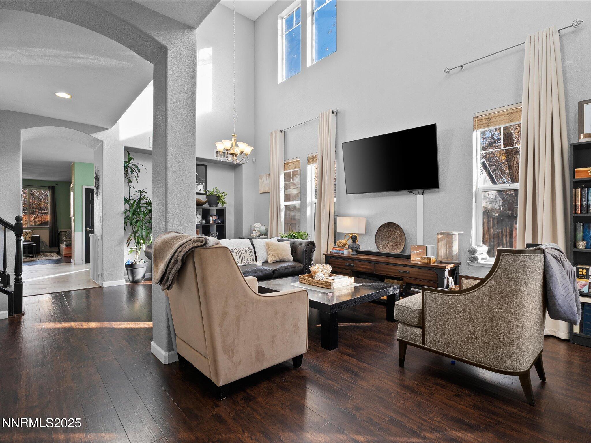 a living room with fireplace furniture and a flat screen tv