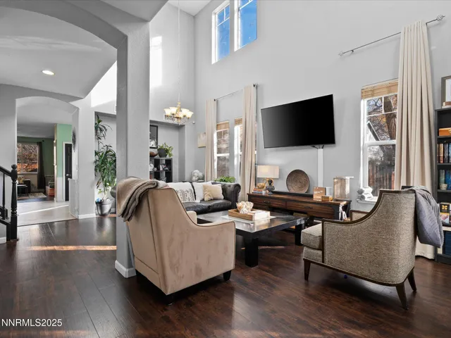 a living room with fireplace furniture and a flat screen tv