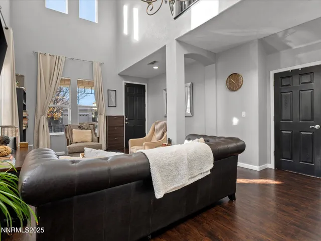 a bedroom with furniture and wooden floor