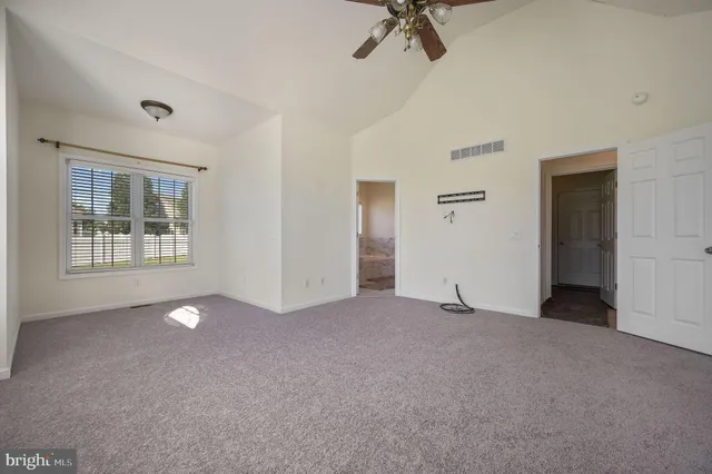 a view of empty room with windows