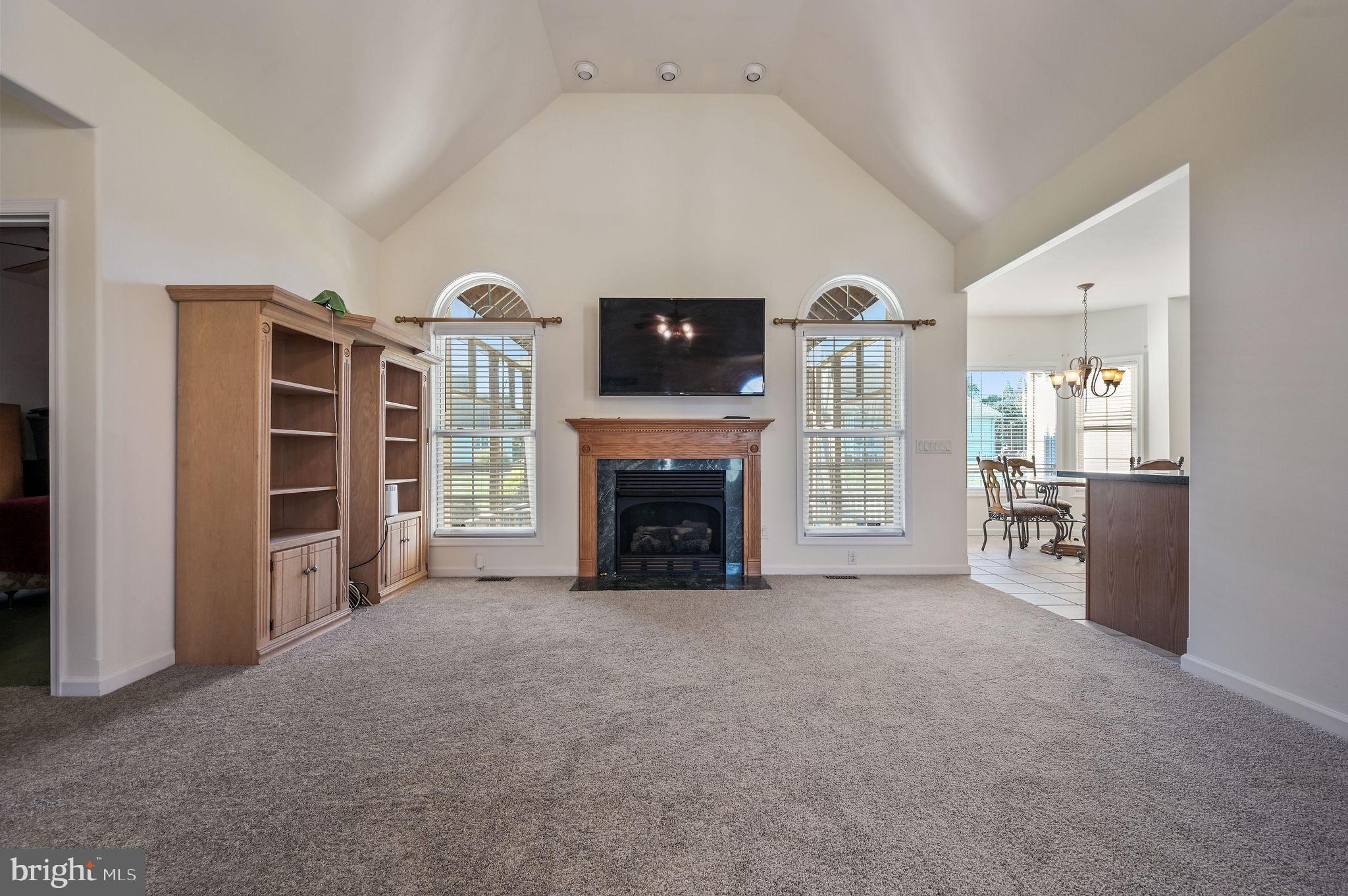 85 Redcrest Court Dover, DE 19904 - Photo 3 of 20 a view of a livingroom with a fireplace and window