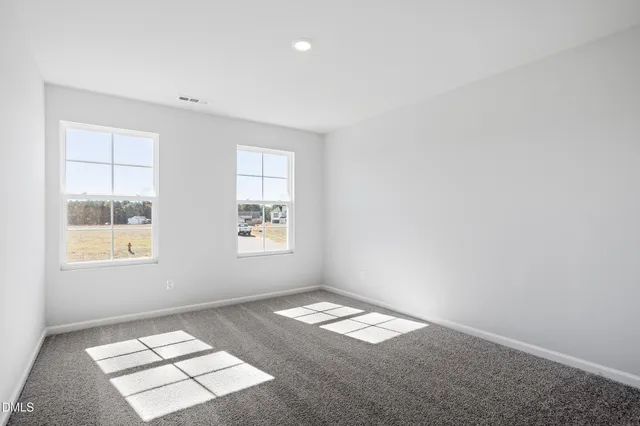 an empty room with windows