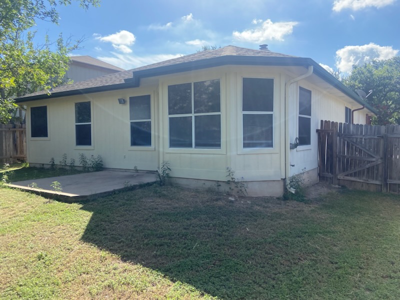 17616 Tobermory Drive Pflugerville, TX 78660 - Photo 2 of 14 A private yard with a concrete patio awaits outdoor enjoyment.