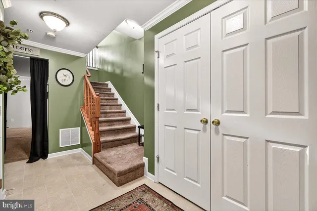 a view of an entryway with stairs