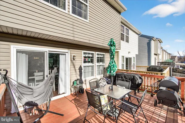 a view of a big house with wooden stairs