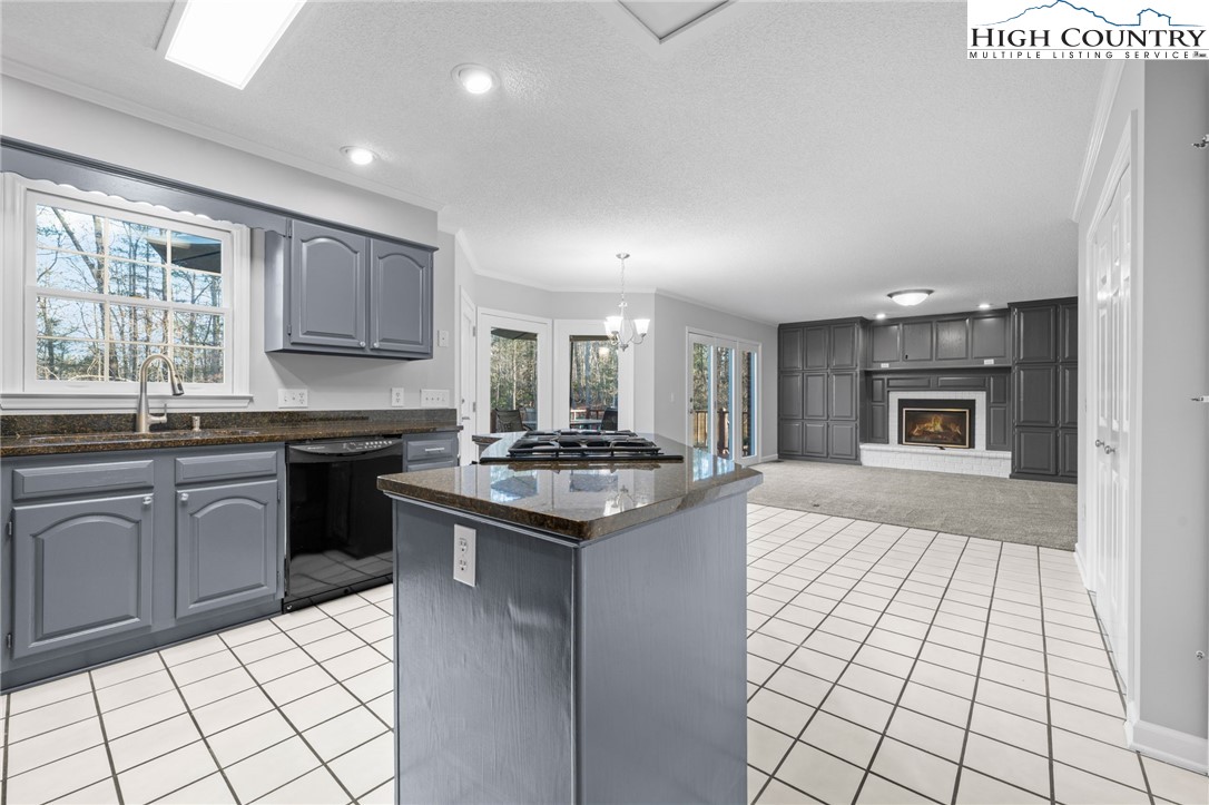 458 Jim Caudill Road Wilkesboro, NC 28697 - Photo 11 of 50 a kitchen with stainless steel appliances granite countertop a stove top oven a sink dishwasher and a refrigerator