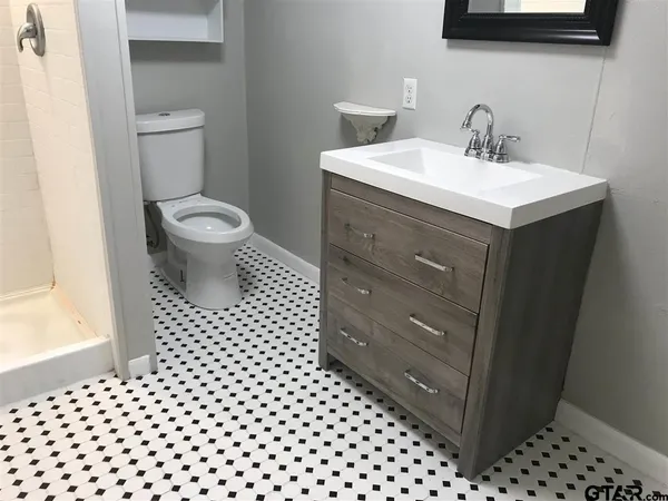 a bathroom with a sink and a toilet
