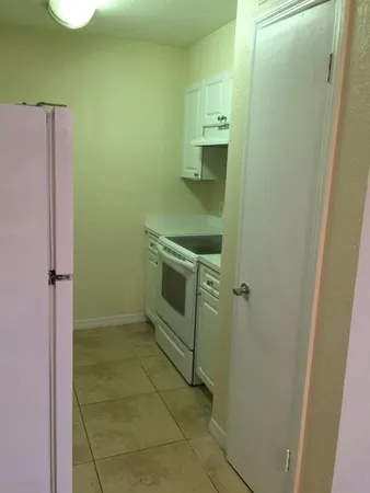 a bathroom with a shower and a sink