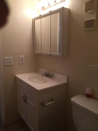 a bathroom with a sink and a toilet
