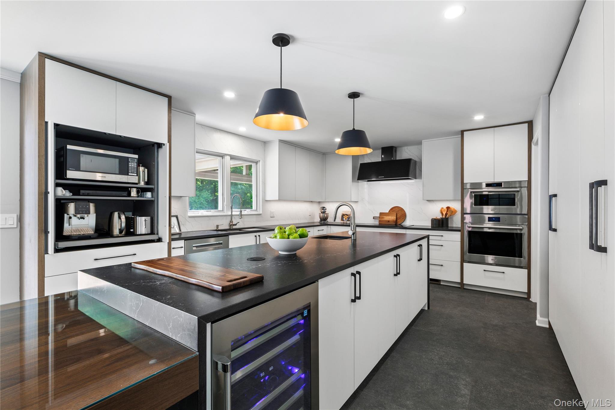 19 John Jay Place Rye, NY 10580 - Photo 15 of 45 The top-of-the-line, stainless steel elements and the strategic appliance garage make this kitchen a high performance culinary hub.